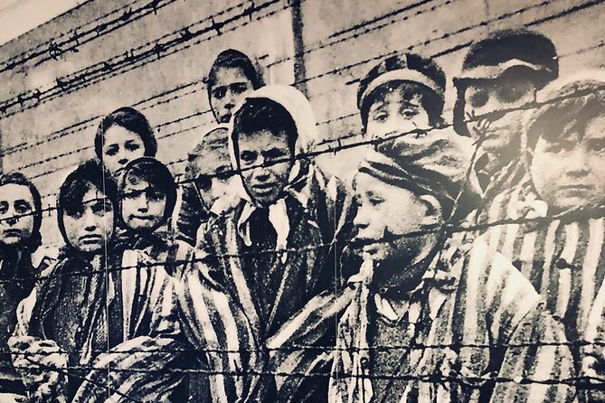 Auschwitz-Birkenau Guided Tour with Private Transport from Krakow - Entering Auschwitz I with a guided visit