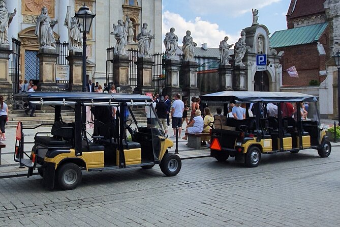 Cracow guided Full tour by Golf Cart-Family Discount - Ghetto Heroes Square and its empty chairs