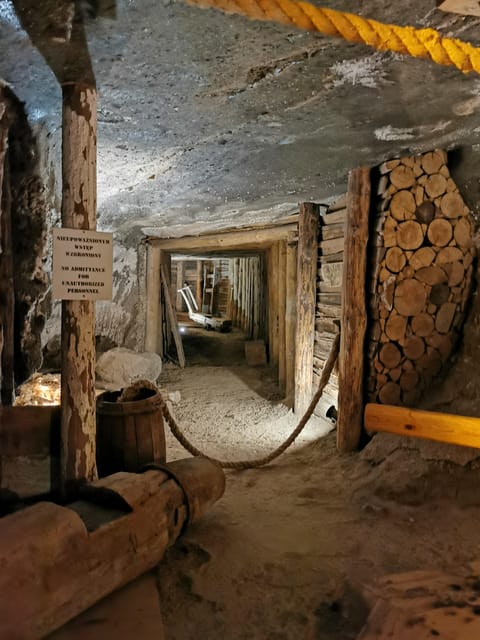 From Krakow: Wieliczka Salt Mine Guided Tour (Hotel Pick-up) - The wooden stairs and the first underground rooms