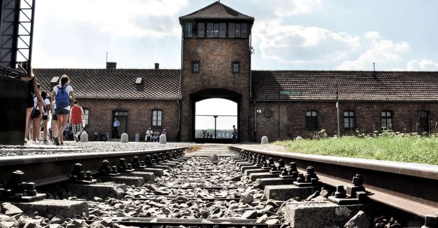 Krakow: Auschwitz-Birkenau Guided Tour Pickup/Lunch Options - Entering Auschwitz I Through the Main Camp