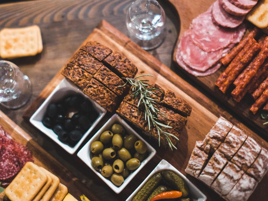 Kraków: Guided Vodka Tour with Food and Drink Tastings - Starting with bread, cheese, and two clear vodkas