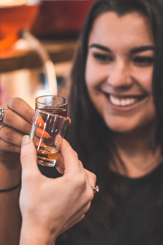 Kraków: Guided Vodka Tour with Food and Drink Tastings - Flavored vodka in candlelight