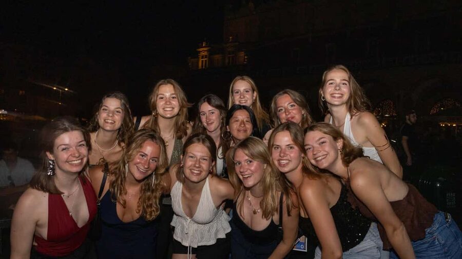 Krakow: Pub Crawl with Shots, Drinks & Skip-the-Line Entry - Starting beneath Adam Mickiewicz in Krakow’s Old Town